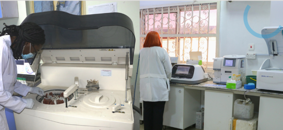 Laboratory scientist working with clinical analysers at Nisa Premier Hospital